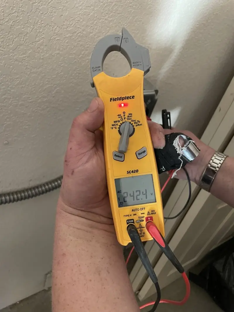 Voltage testing with clamp meter during Outlet Installation in Maple Heights